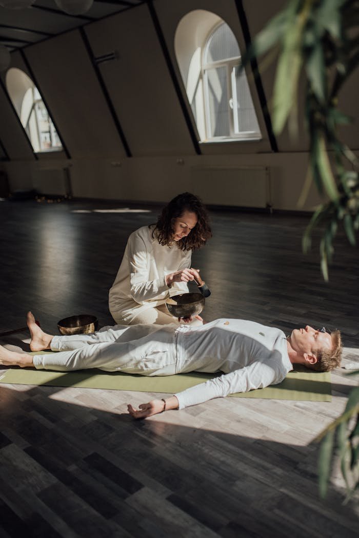 Serene indoor wellness session with a Tibetan singing bowl for relaxation and meditation.